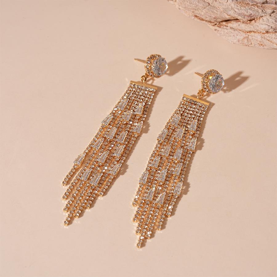 Silver needle-golden tassel earrings