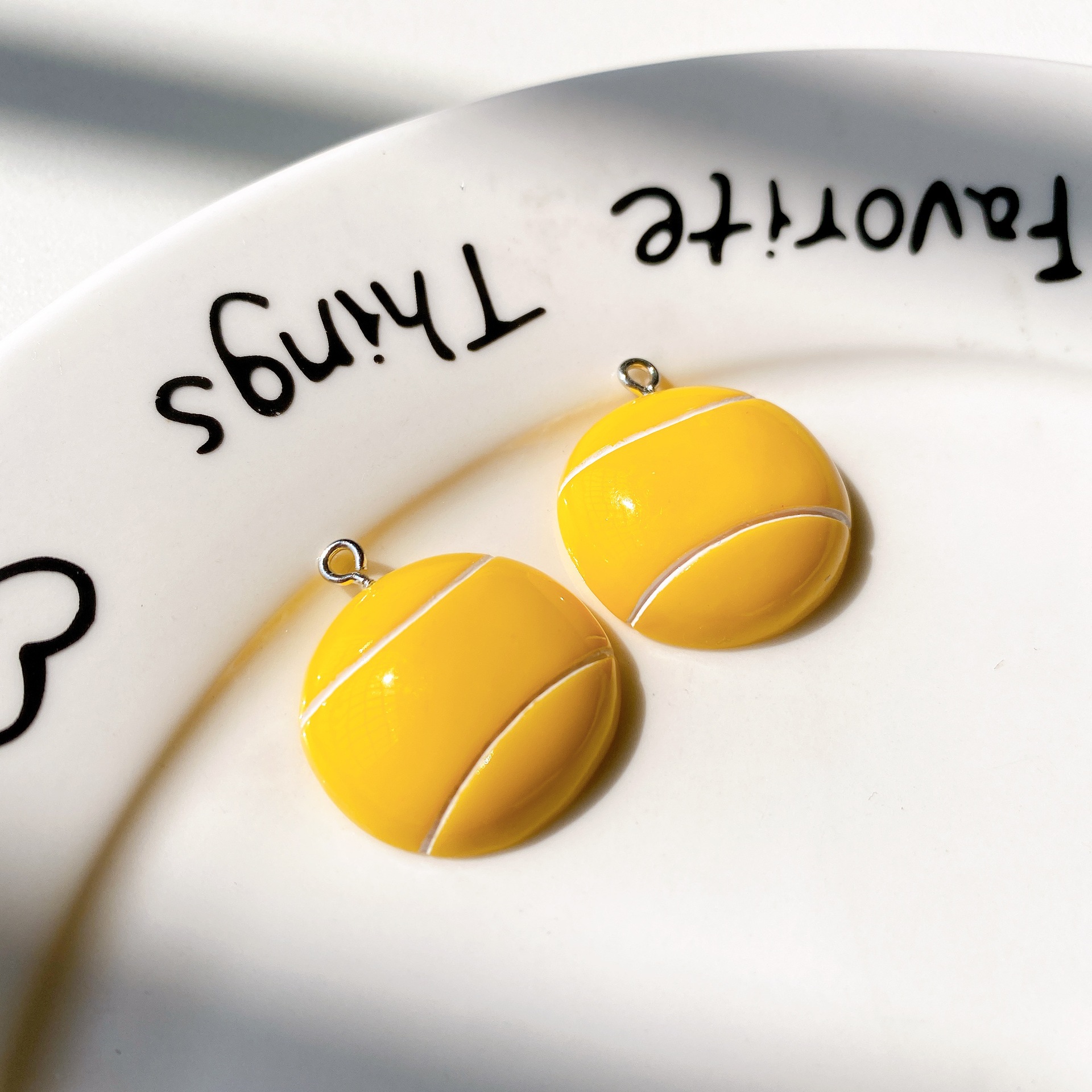 Yellow ball and white nails
