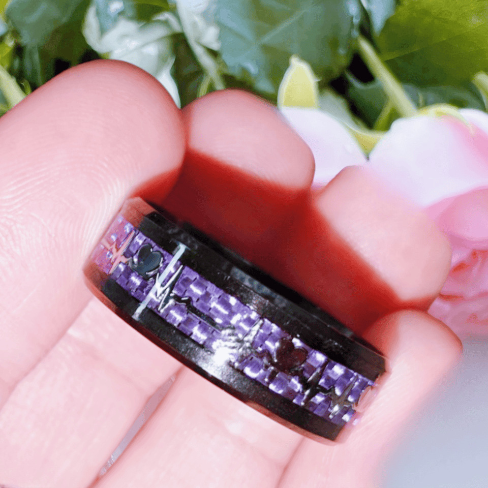 Purple carbon fiber electrocardiogram on black background