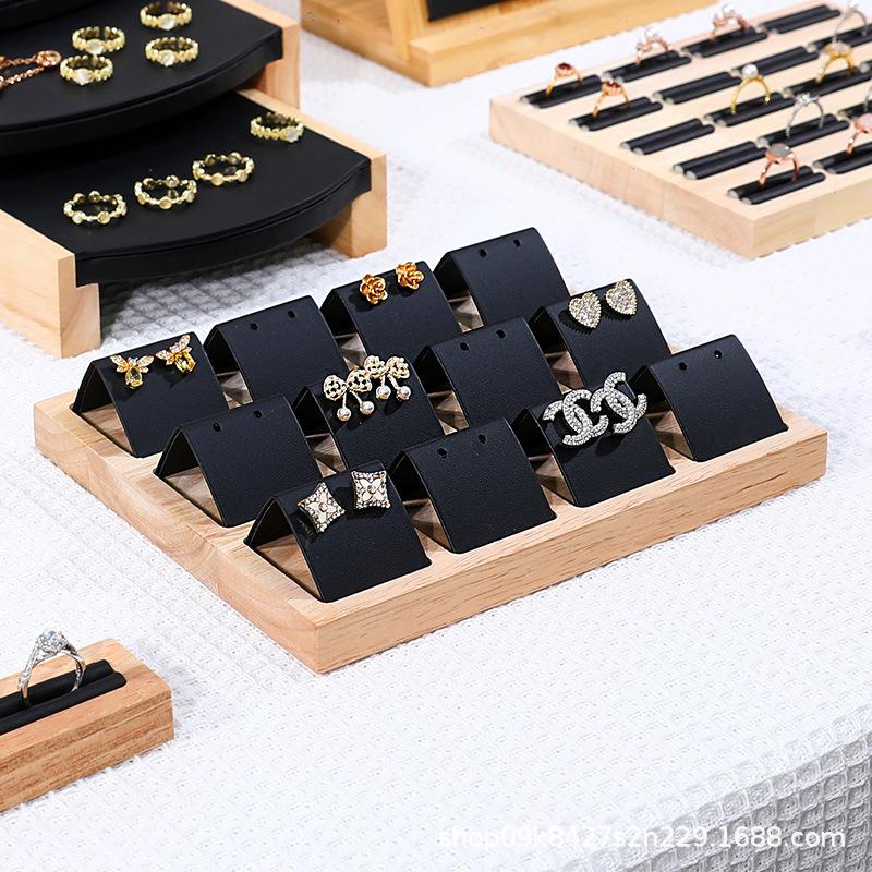 Black leather twelve-position earring base