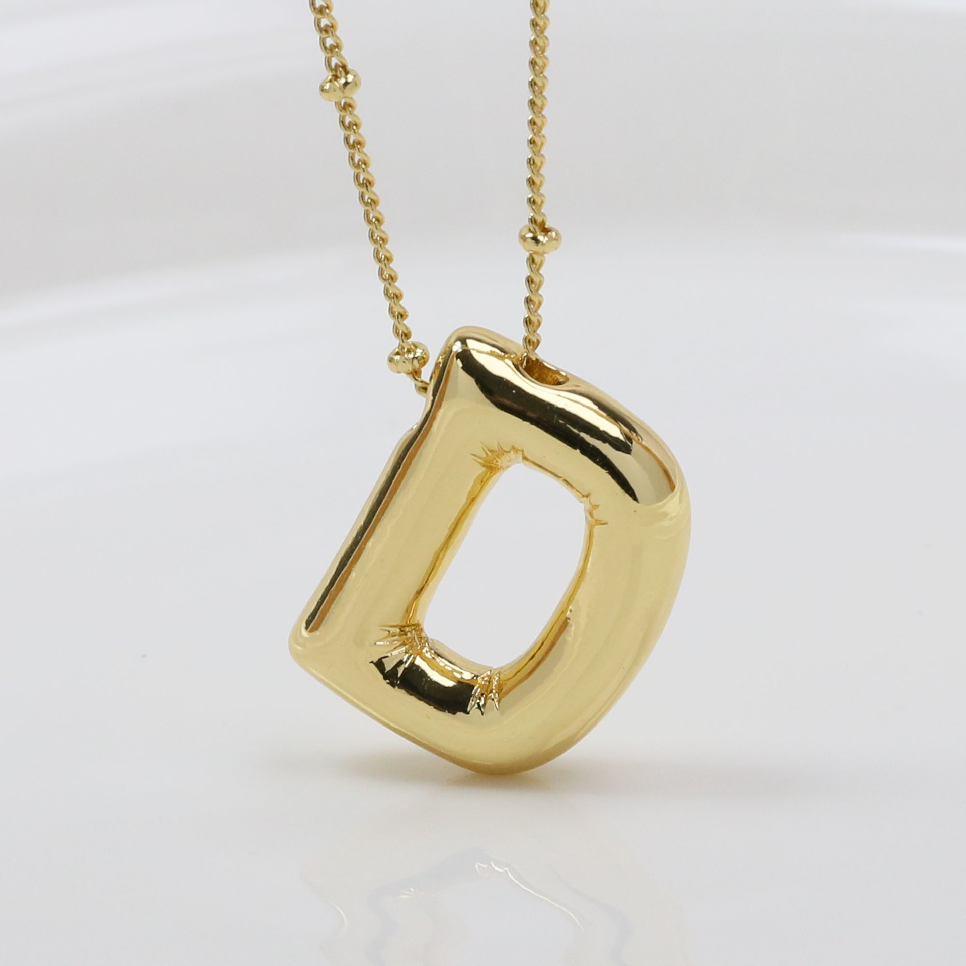 D (Necklace)