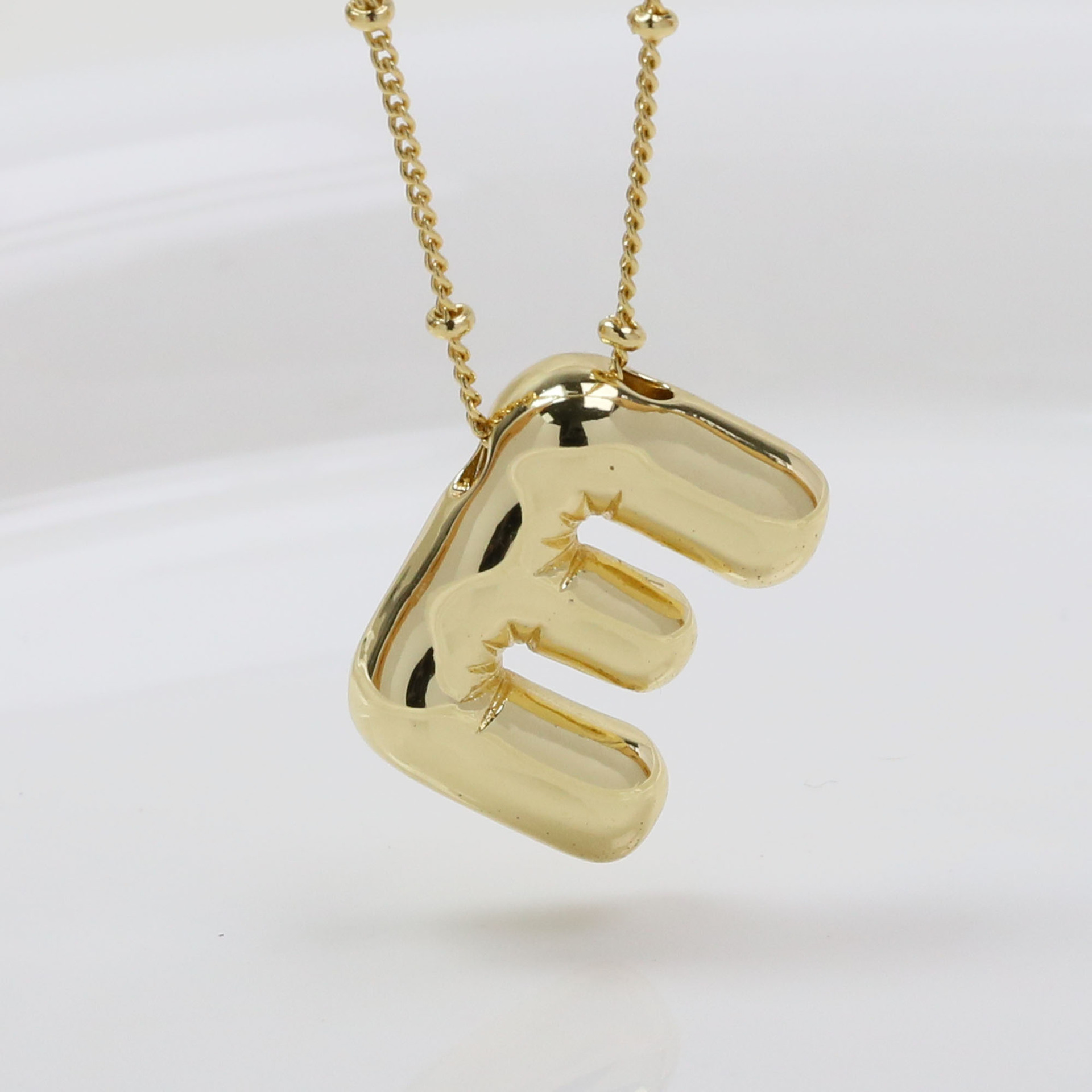 E (Necklace)