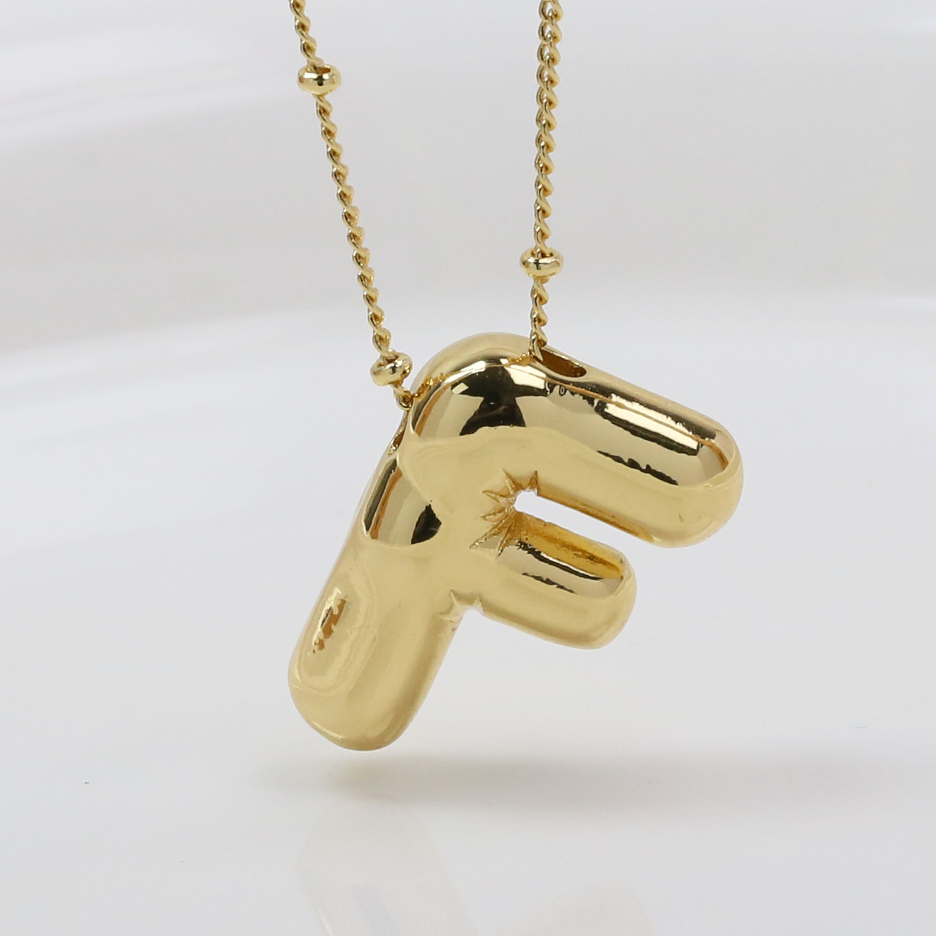 F (Necklace)