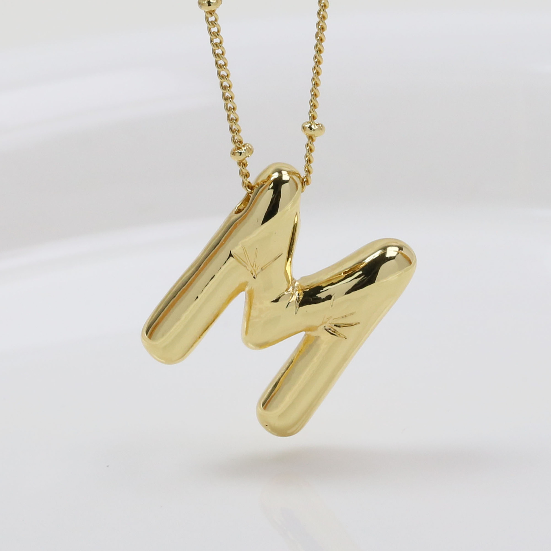 M (necklace)