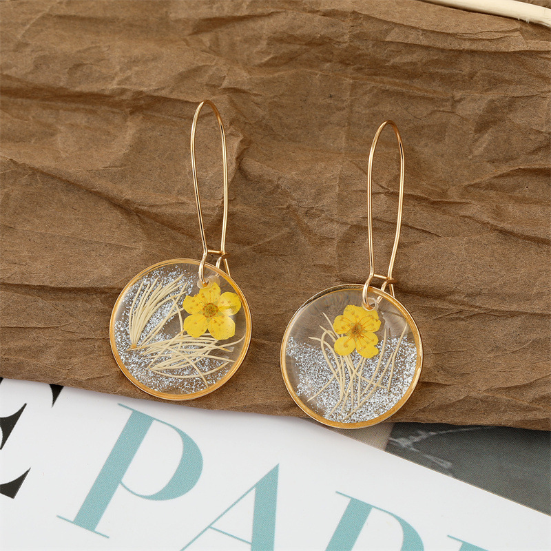1 small round yellow flower