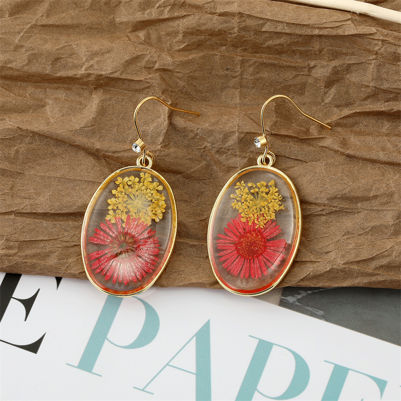 3 oval red and yellow flowers