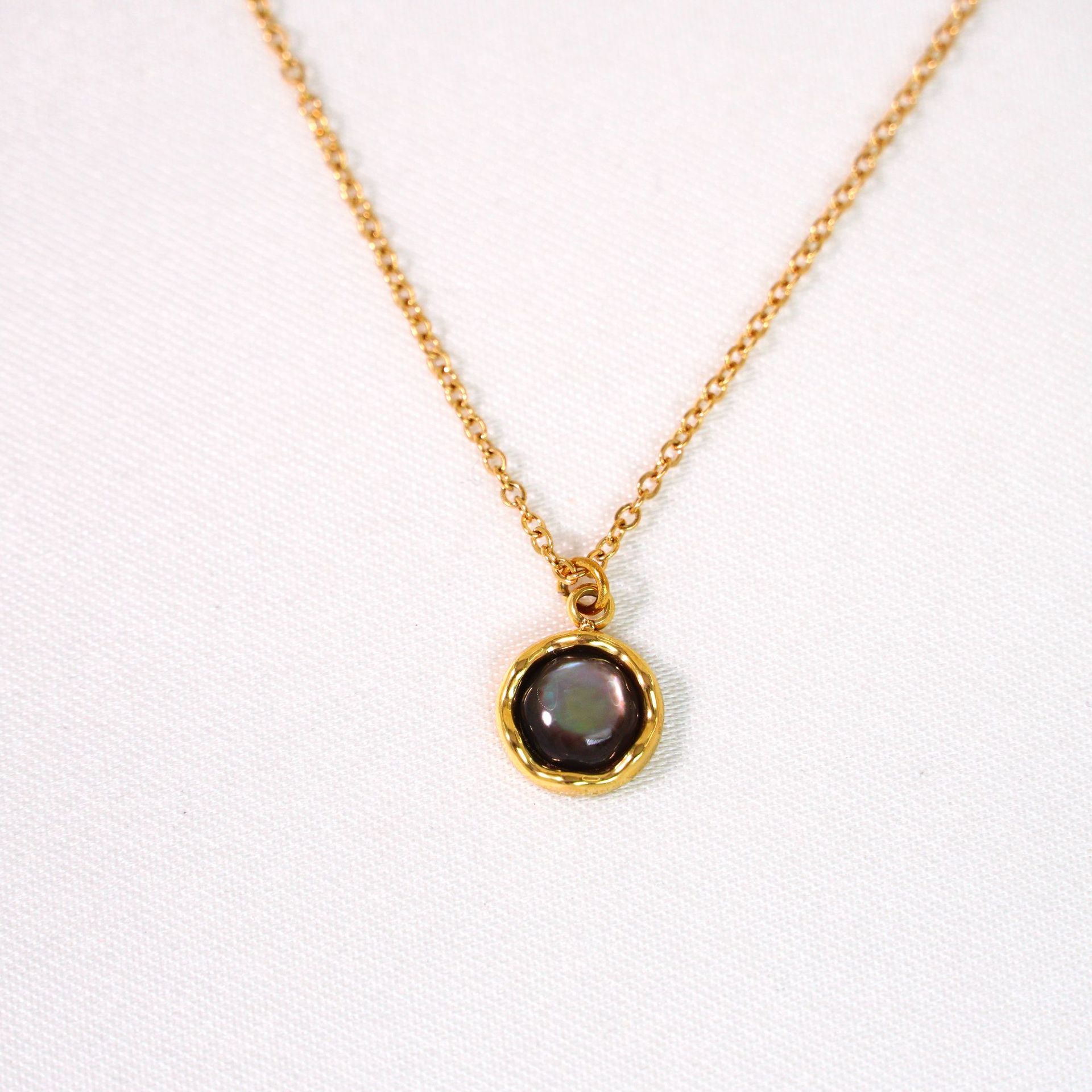 Beaded black shell