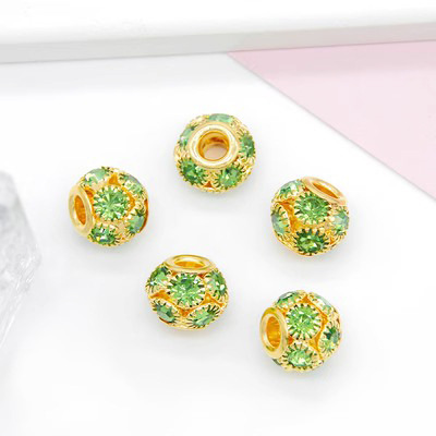 Gold base with light green diamond