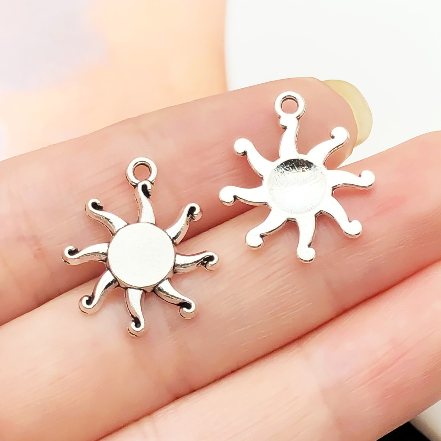 7699-1 ancient silver zinc alloy sun 16x19-0.9g