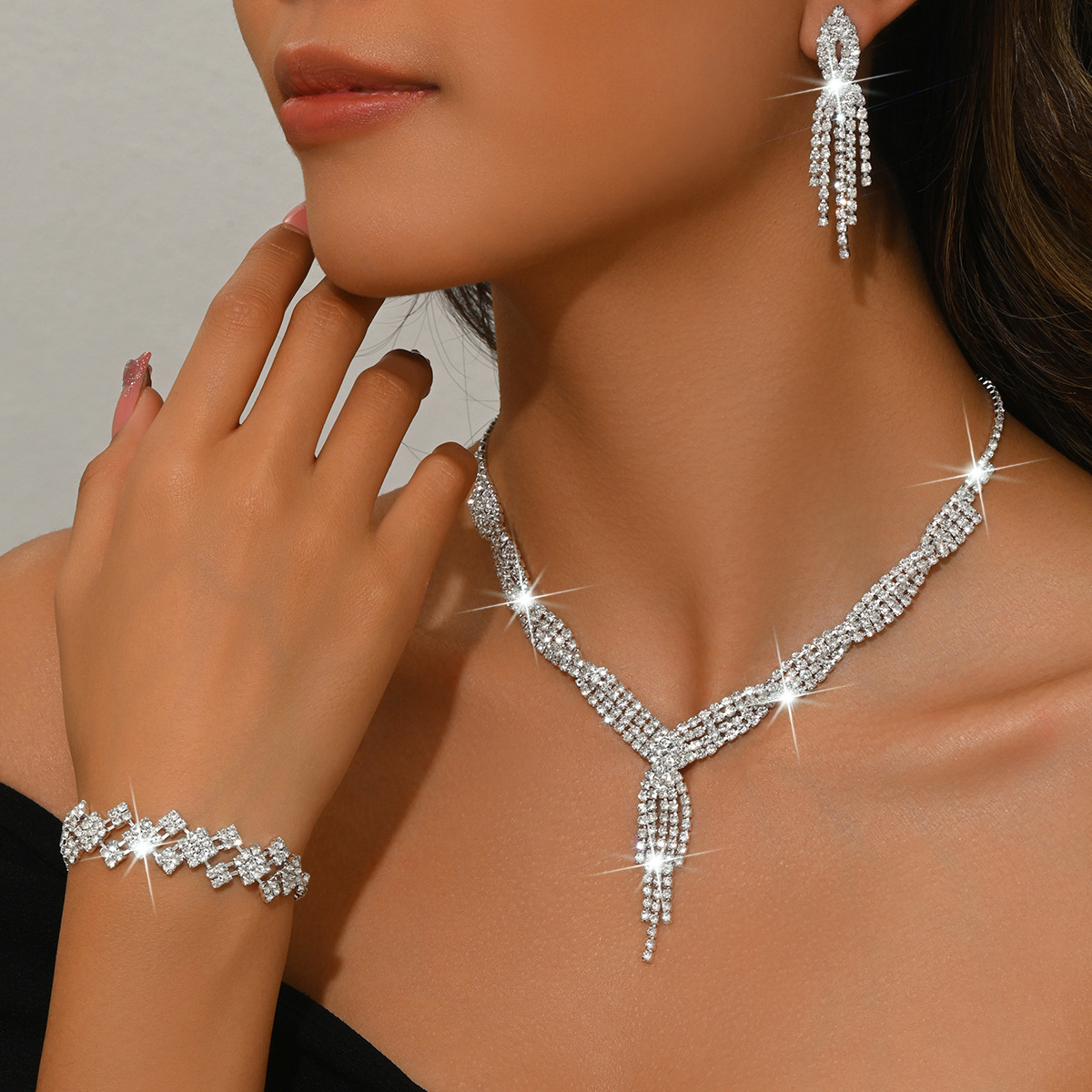 A silver necklace earrings bracelet set