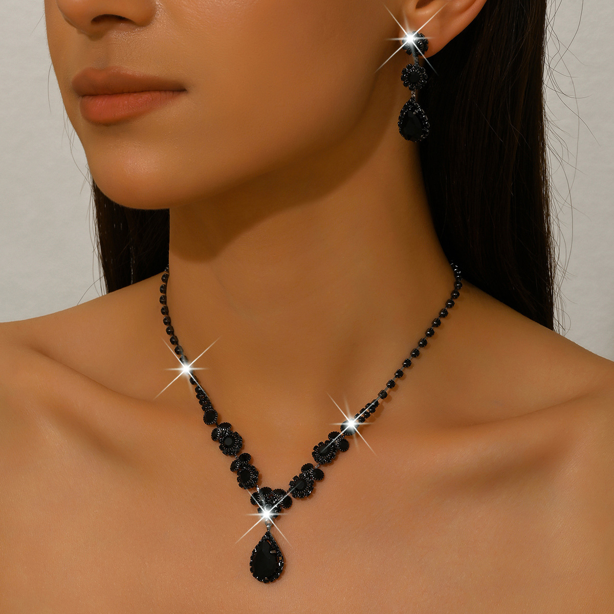 1675 gun black necklace earrings