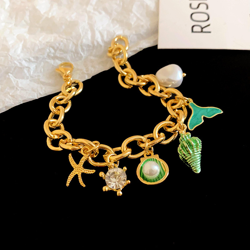 Green starfish and conch bracelet