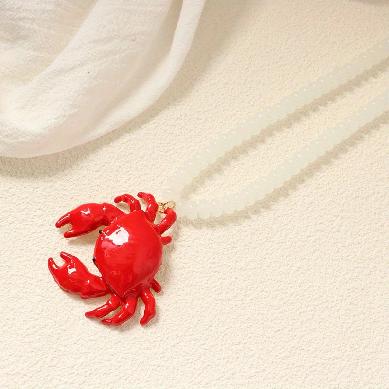 White beaded red crab necklace