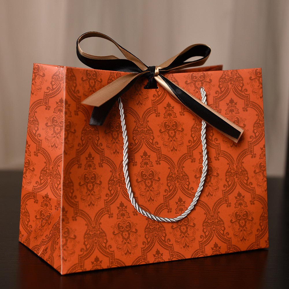 Orange with gold and black ribbon; white cardboard; small size18*16*10cm
