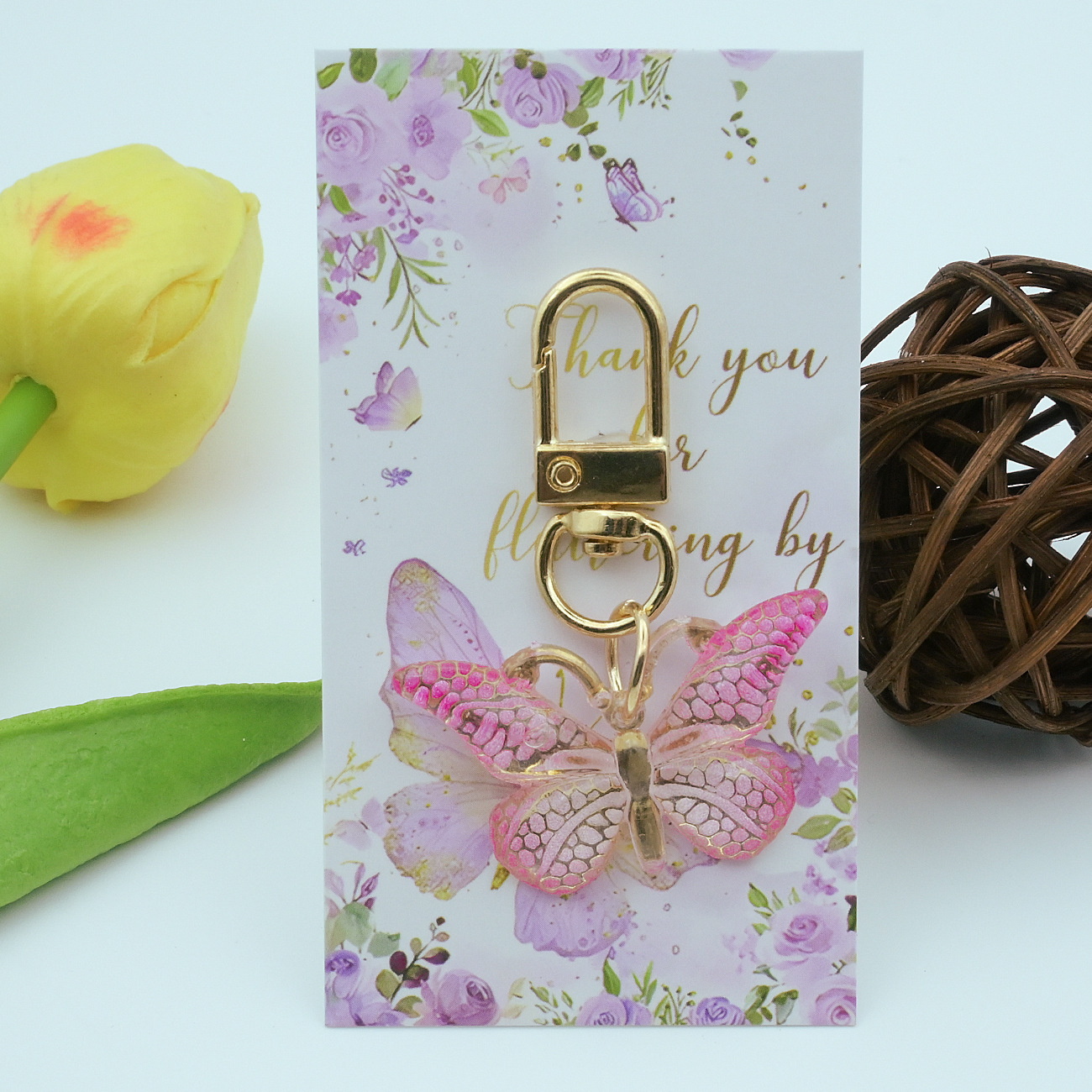 Pink butterfly keychain + cardboard