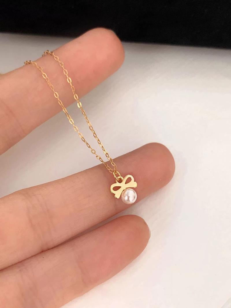 Pearl bow necklace gold color