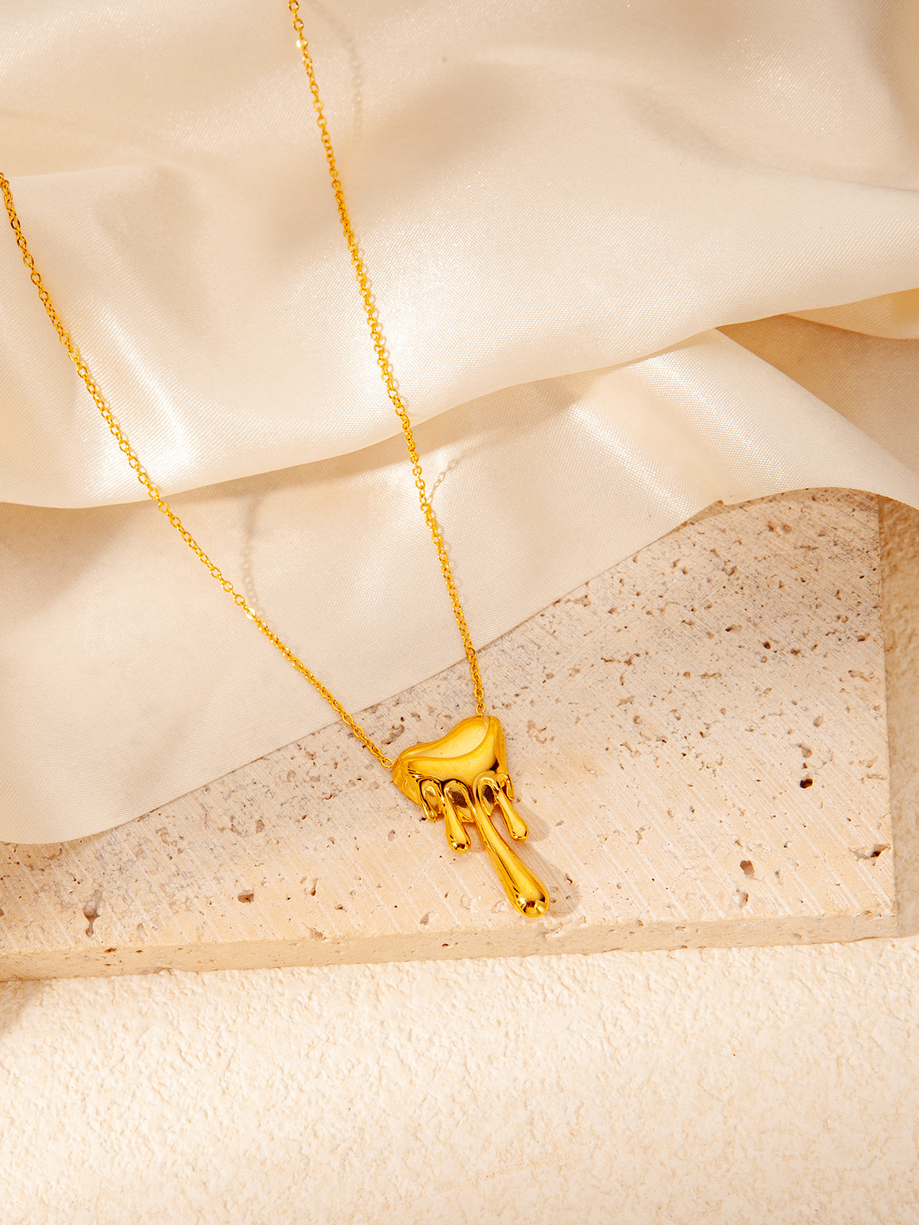 Gold melted love necklace