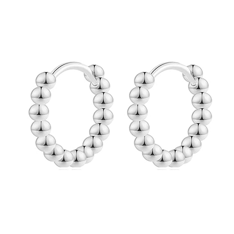 A pair of silver beads