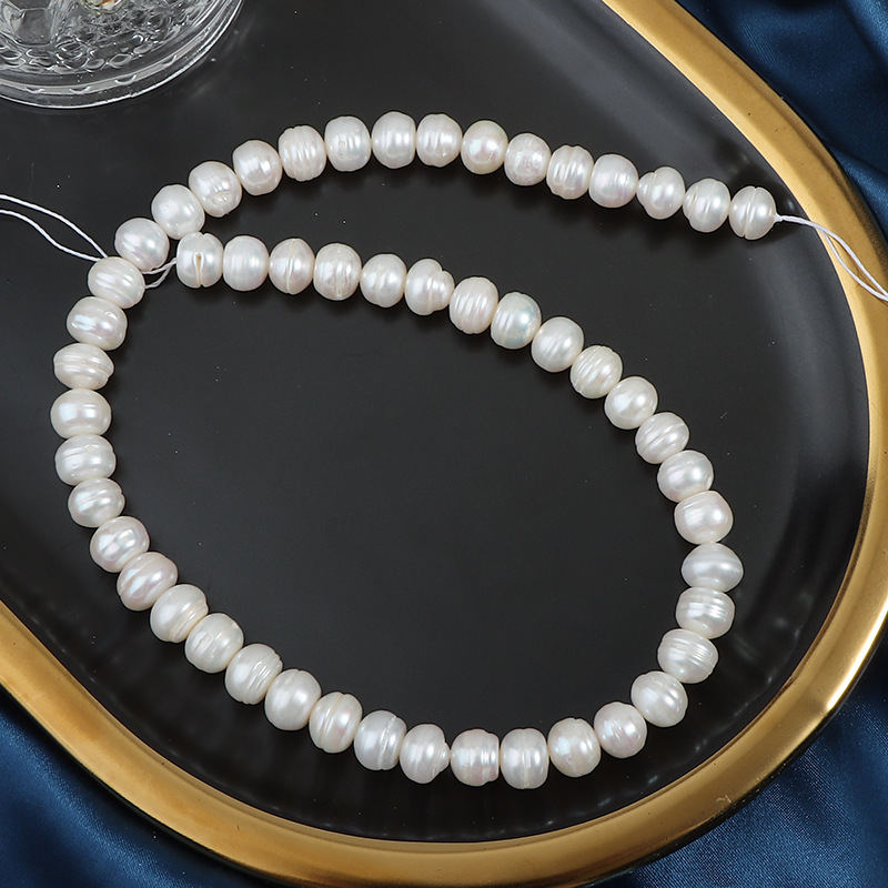 9mm, about 50 pieces in a string of 38cm