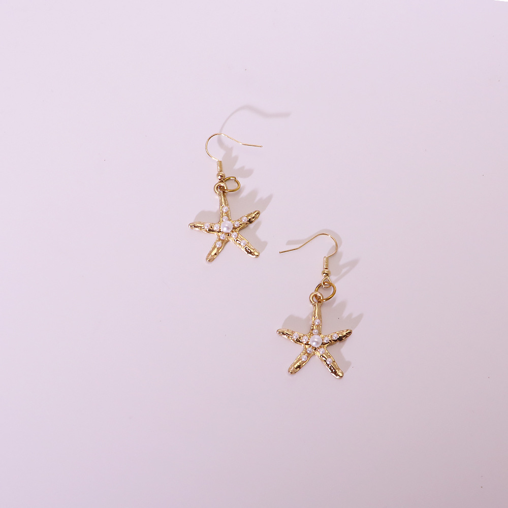 Gold starfish earrings