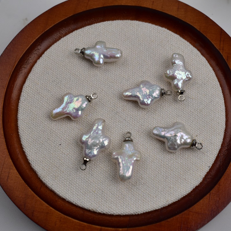 Sheep's eye/small cross pendant - approximately 12-16mm