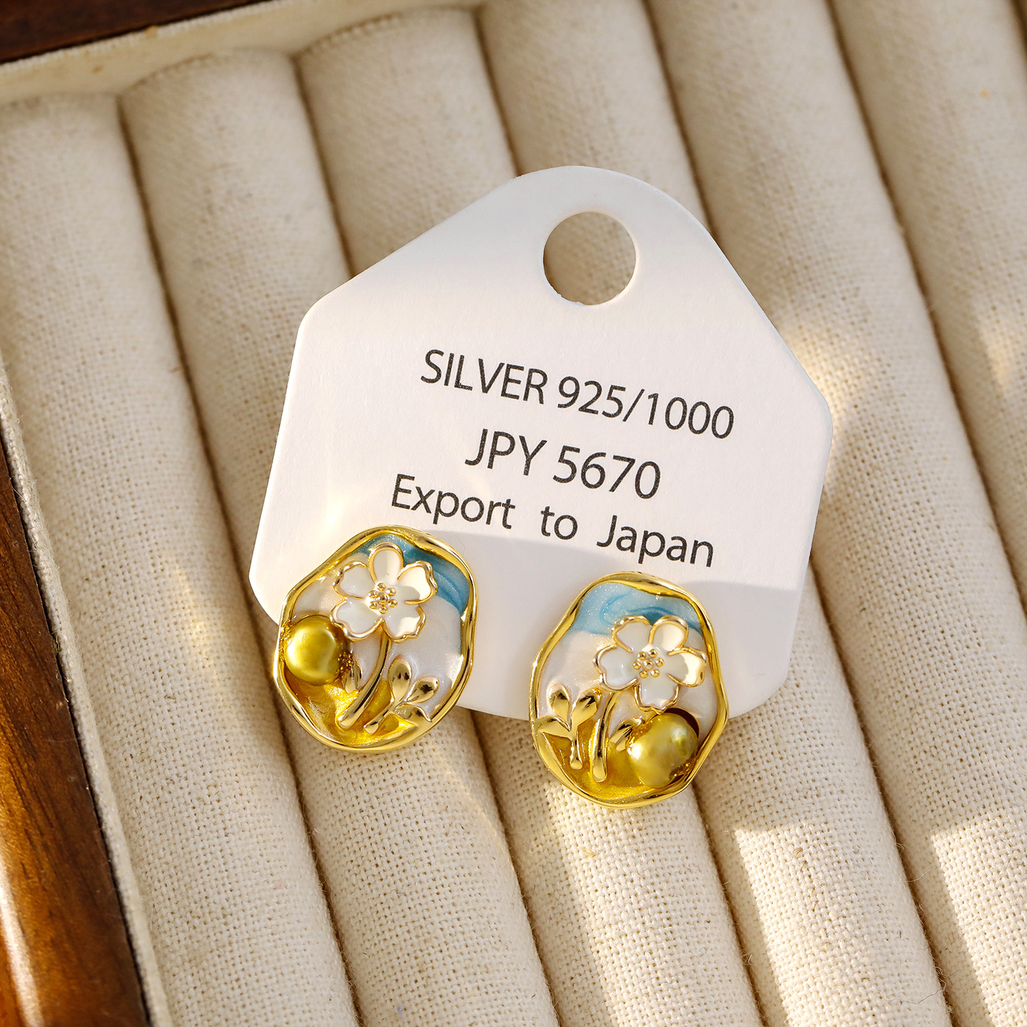 Light blue, 2cm long and 1.7cm wide