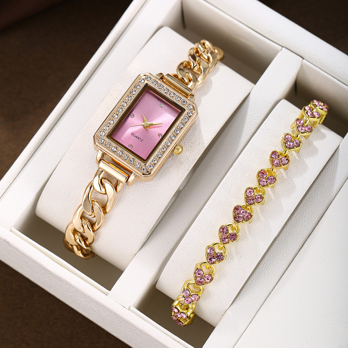 A set of golden pink heart-shaped bracelets