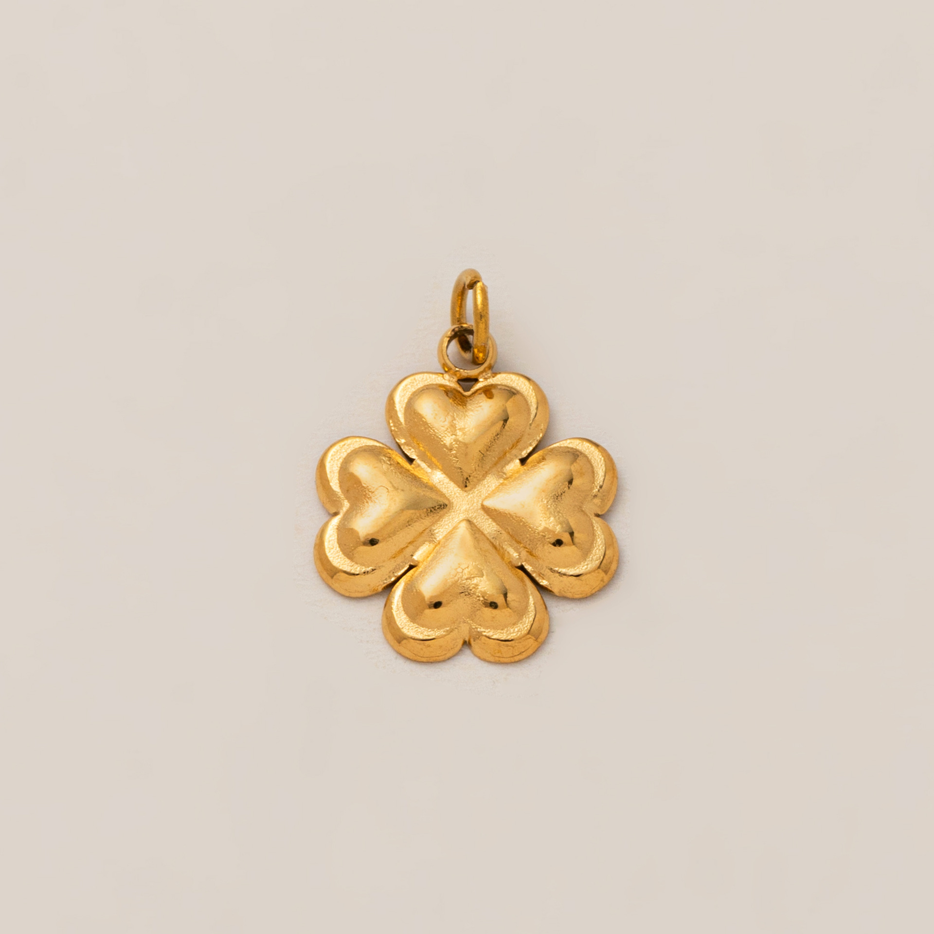 Gold four leaf clover pendant