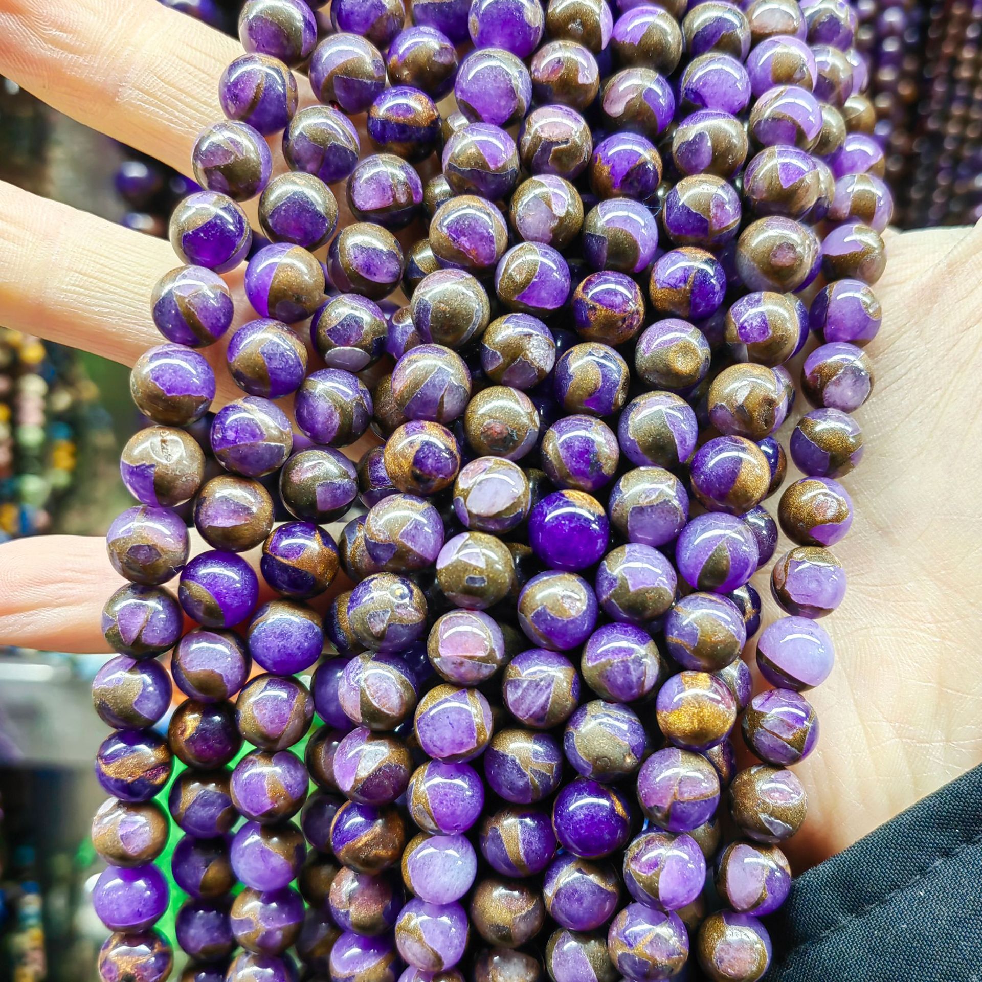 Gold colored stone--purple