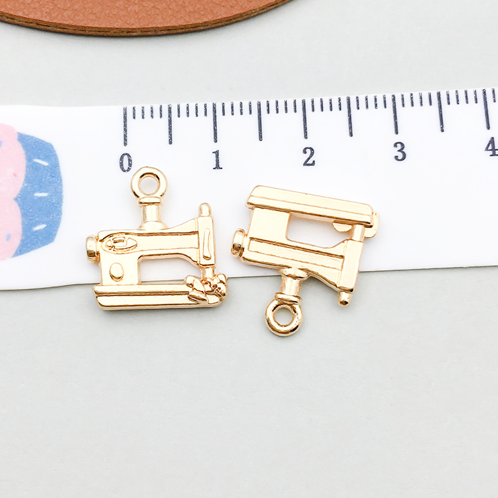 1 kc gold sewing machine 15*16mm-1.1g-20243