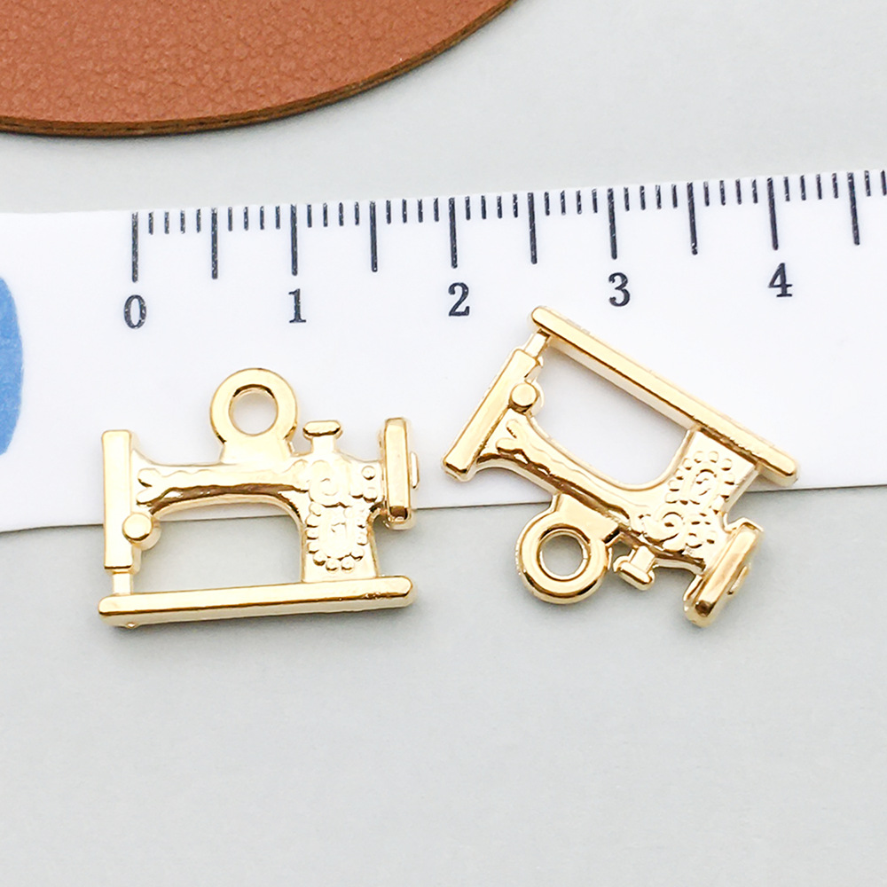 1 kc gold sewing machine 19*15mm-1.9g-20254