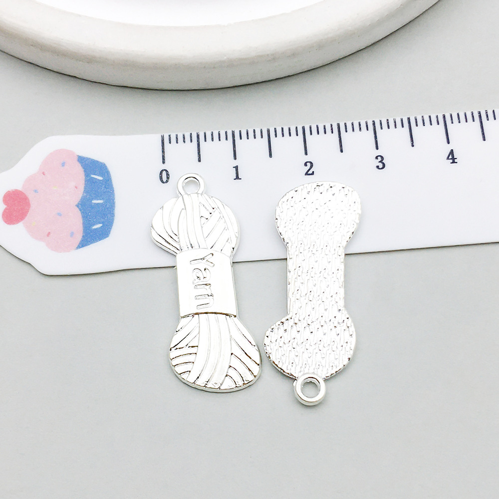 1 bright silver wool ball 12*31mm