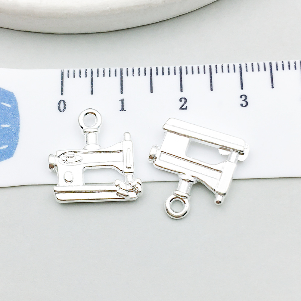 1 bright silver sewing machine 15*16mm