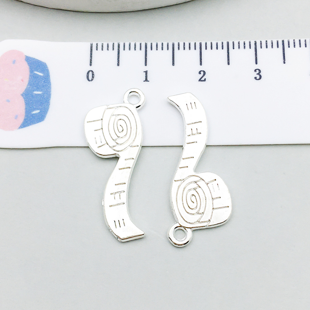 1 bright silver measuring tape 11*27mm-