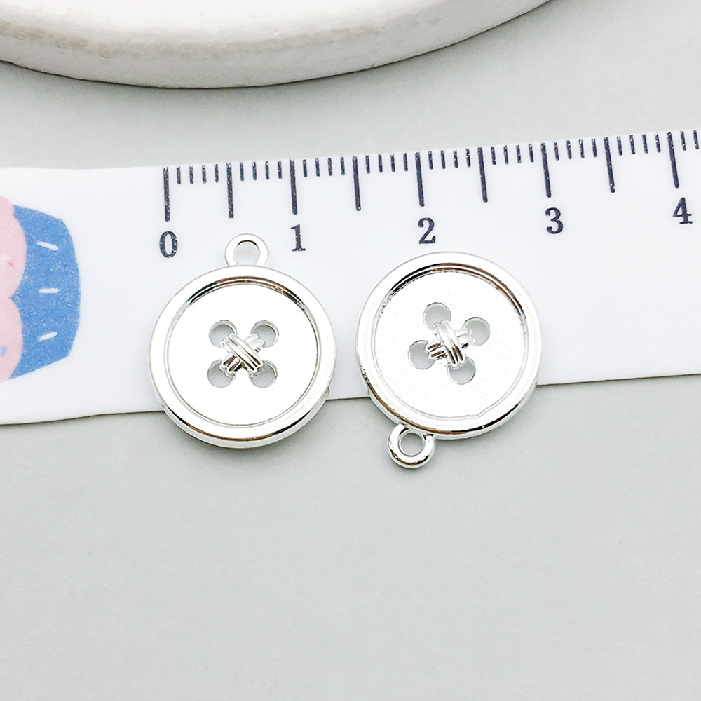 1 bright silver button 14*17mm-