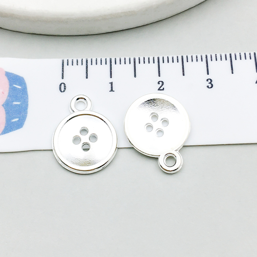 1 bright silver button 13*16mm