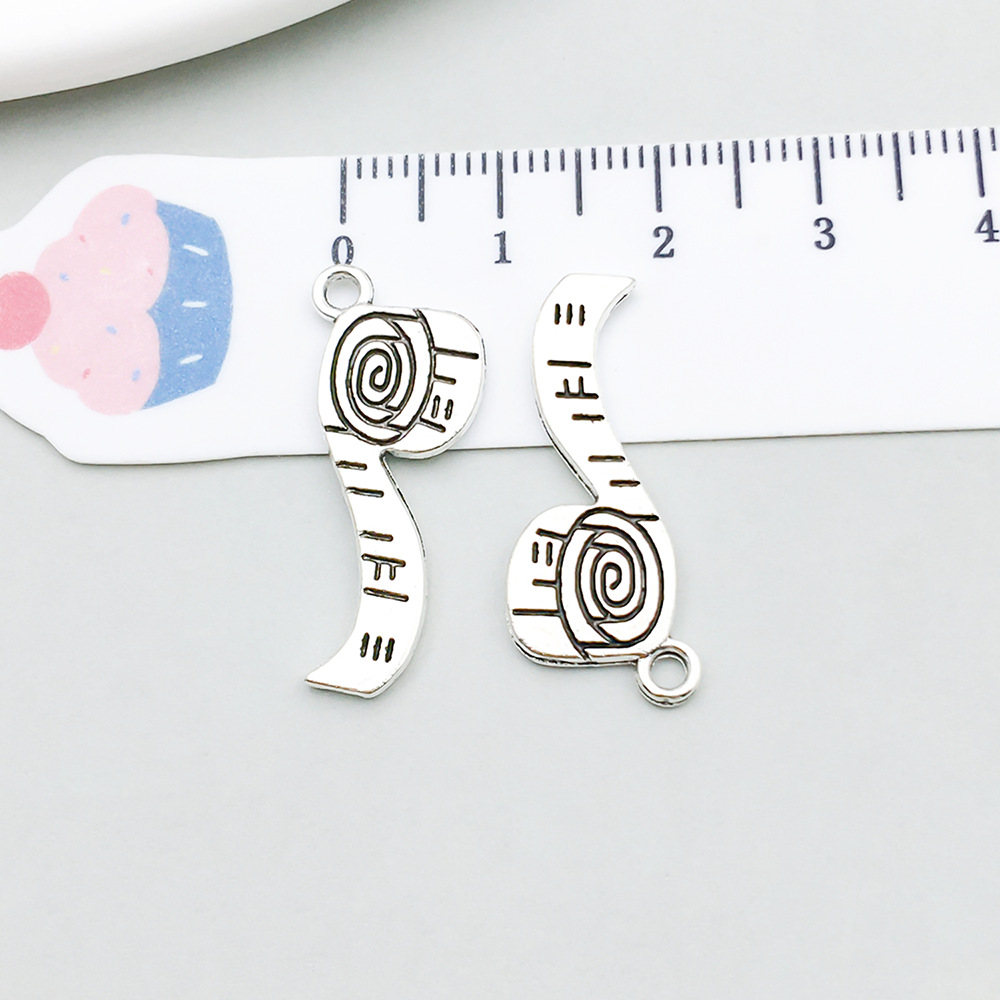 1 ancient silver measuring tape 10*27mm