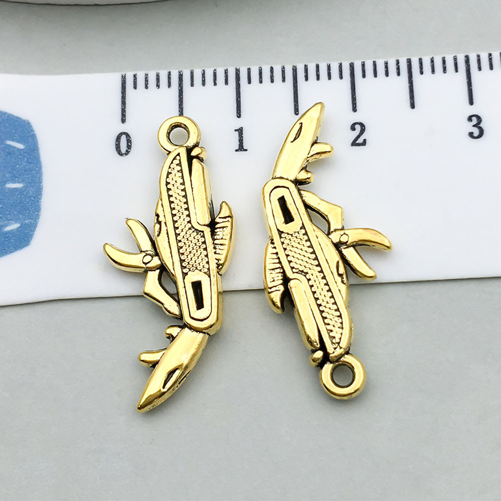 1 ancient gold folding knife 25*11mm