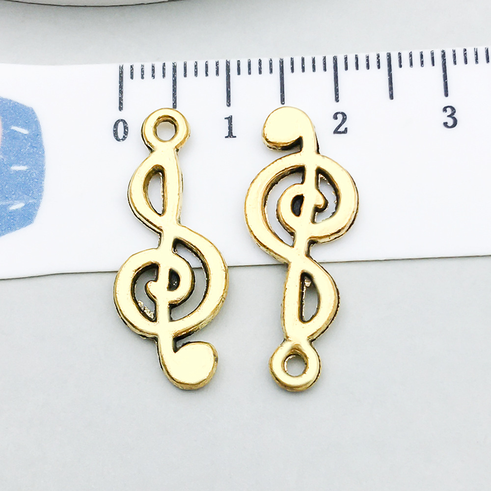 1 ancient gold music symbol 25*10mm