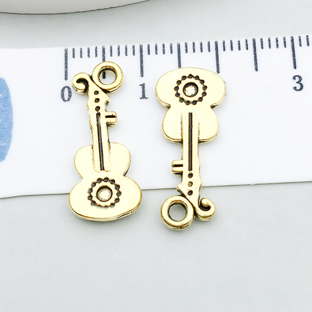 1 ancient gold guitar 9*21mm