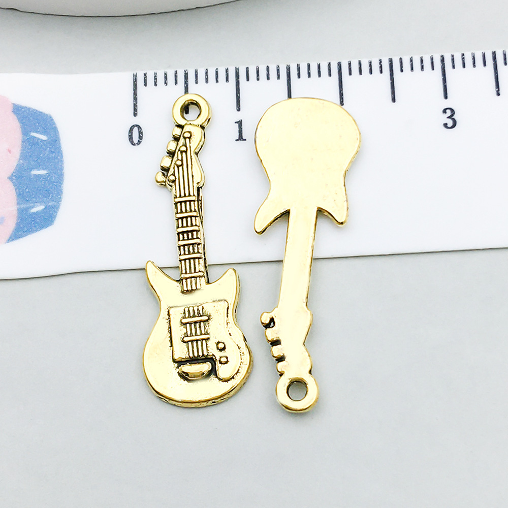 1 ancient gold guitar 12*31mm