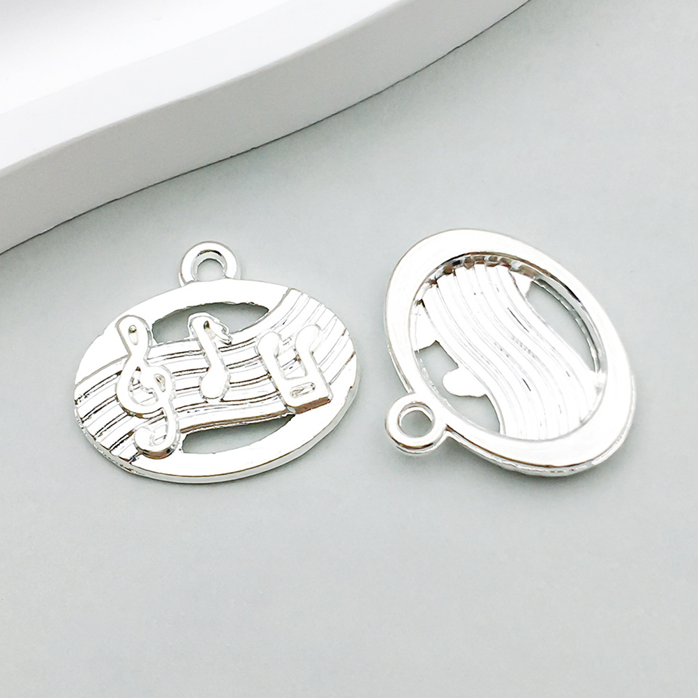 1 bright silver music symbol 17*19mm