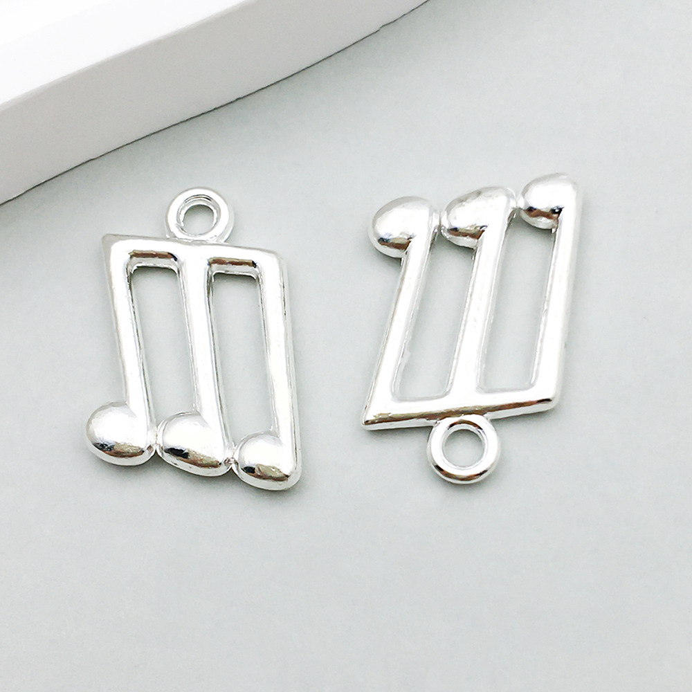 1 bright silver music symbol 13*21mm