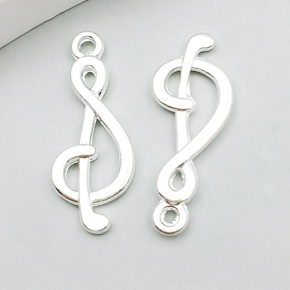 1 bright silver music symbol 10*27mm