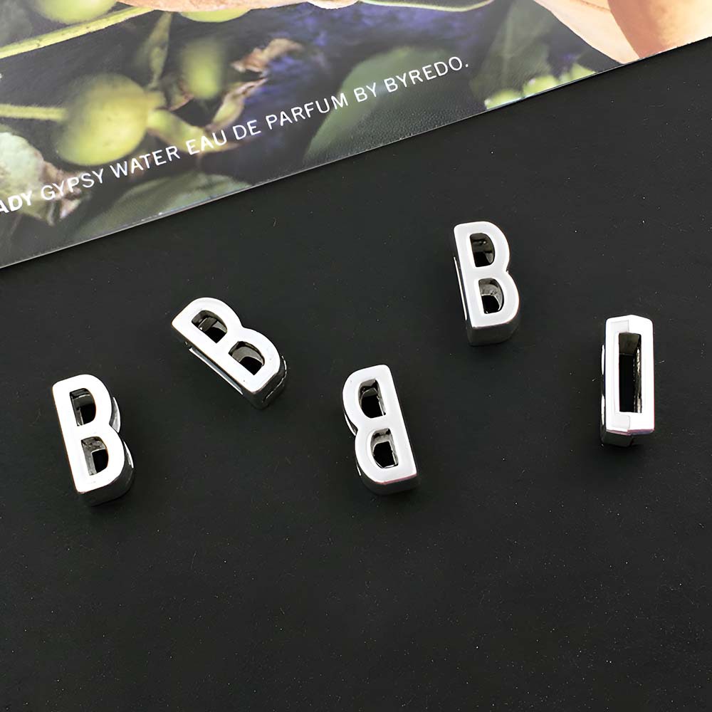 1 ancient silver perforated letter B- 5x10mm-0.7g