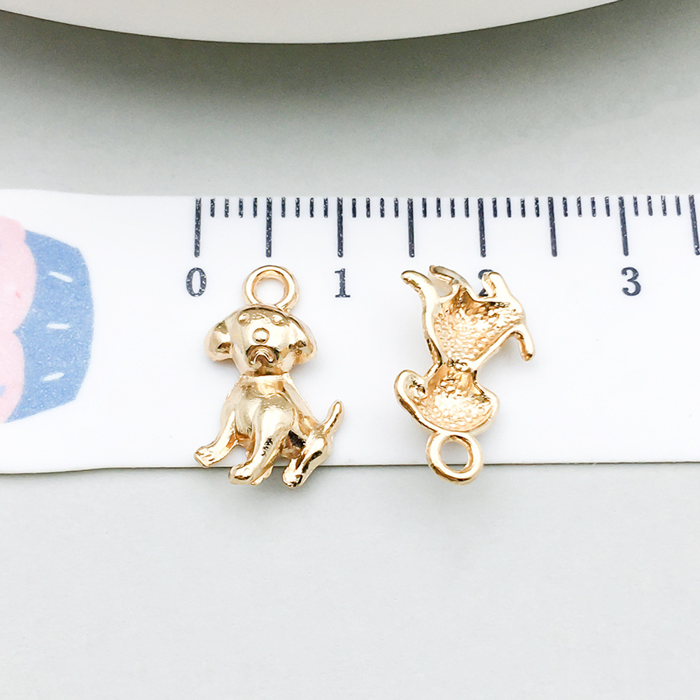 1 kc gold sitting dog 17*10mm-0.7g-20518