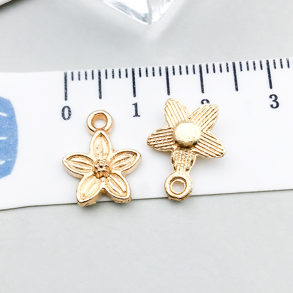 1 kc gold flower 11*14mm-0.7g-18326