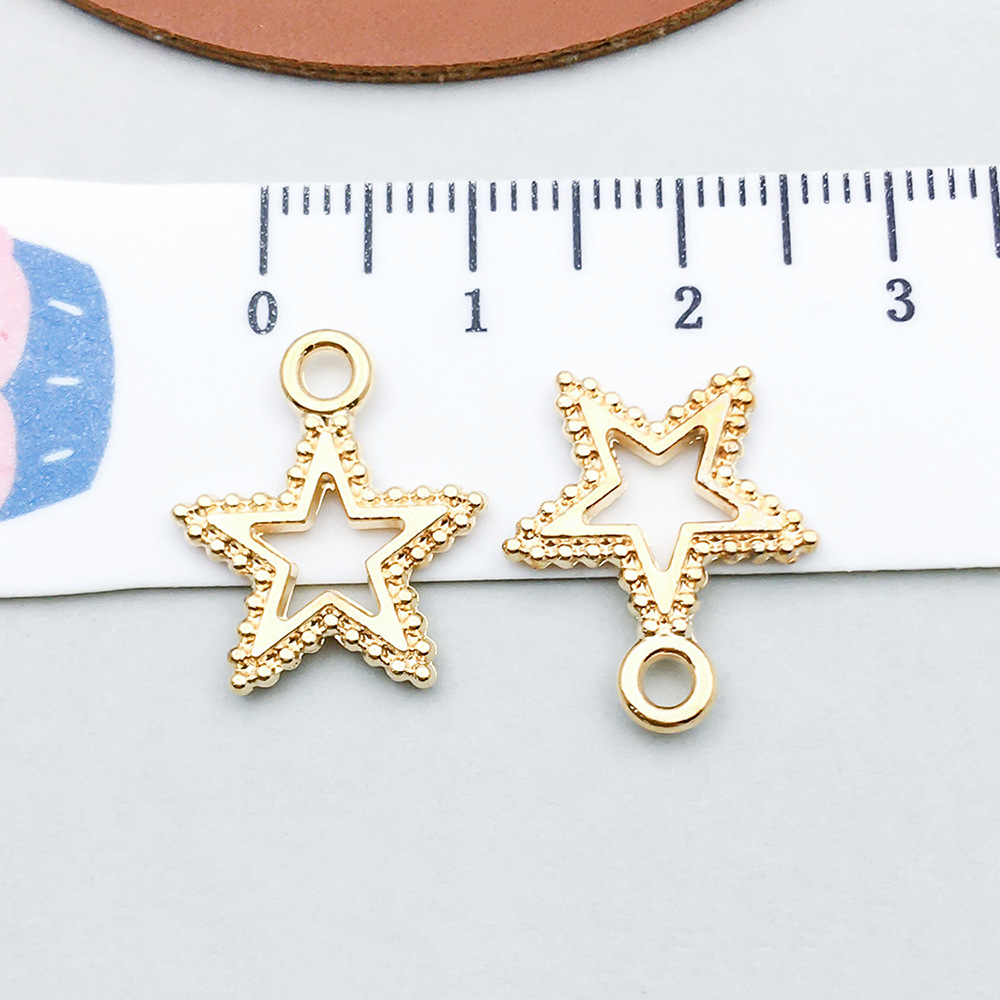 1 kc gold hollow five-pointed star 15*17mm-0.7g-18248