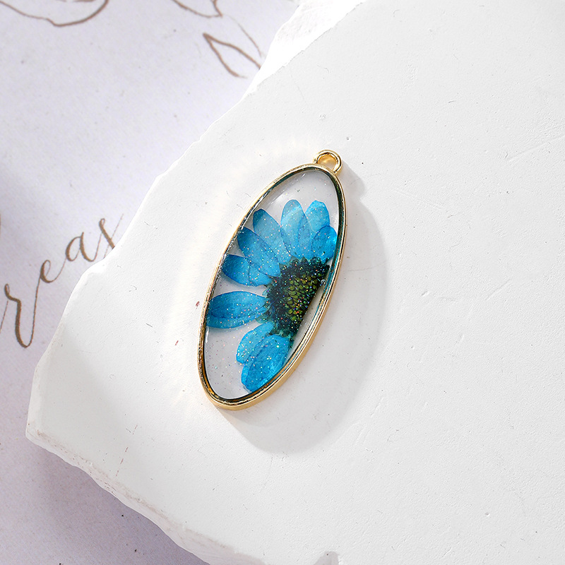 4 glitter oval blue daisy
