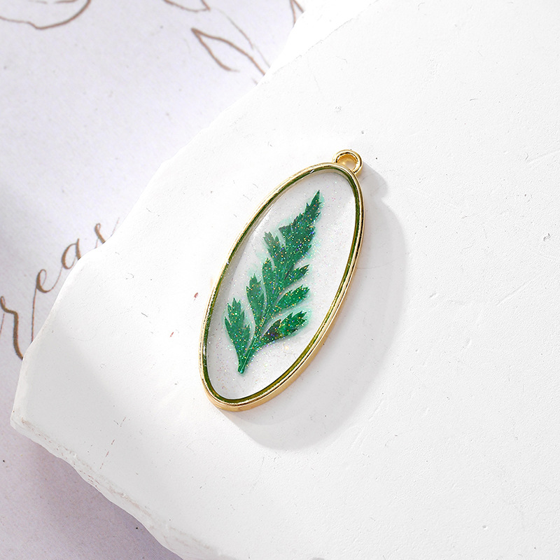 5 glitter oval green leaves